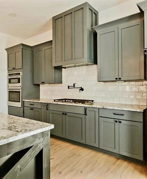 Sage Green Cabnits Kitchen, Army Green Cabinets Kitchen, Gray And Green Kitchen Ideas, Modern Farmhouse Kitchens Green Cabinets, Green Cabinets Grey Countertops, Olive Green Kitchen Ideas, Green Kitchen Cabinets Black Hardware, Kitchen Remodel Green Cabinets, Gray Kitchen Ideas Color Combos