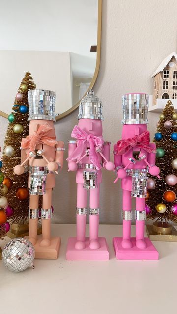 Deborah Trette on Instagram: "diy disco nutcrackers! I picked up wooden craft ones from @michaelsstores, painted with acrylics and attached mirror ball strips! easy but so extra! 💫 make sure to save and share! #diy #diychristmas #christmasdecor #christmascraft #christmasidea #falala #nutcrackers #whimsical #discoball #happyholidays #pinkmas #xmascrafts #makeitwithmichaels #diynutcracker #bhgstylemaker #easydiy #easycraft" Pink Nutcracker Christmas Diy, Girlie Christmas Decor, Pink Whimsical Christmas, Christmas Nutcracker Diy, Christmas 2024 Trends Diy, Paint Nutcracker Diy, Pink Disco Christmas, Disco Nutcracker, Diy Whimsical Christmas Decor