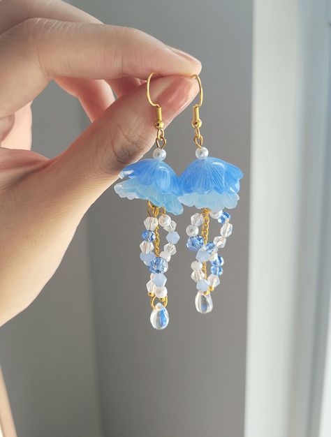 "Add something extra to your outfits with these cute jellyfish earrings! The dangle length is around 7cm/2.7\". It is made with gold wire, shrink plastic, and crystal beads. Each pair is lovingly handmade! 🎀 CARE INSTRUCTIONS 🎀 * Avoid getting your jewelry wet * Avoid perfumes or sprays * Store in a cool, dry place" Shrink Plastic Jellyfish, Jelly Fish Earrings, Jellyfish Earrings Diy, Water Accessories, Jellyfish Jewelry, Jellyfish Earrings, Cute Jellyfish, Handmade Jewelry Wire, Shrink Plastic Jewelry