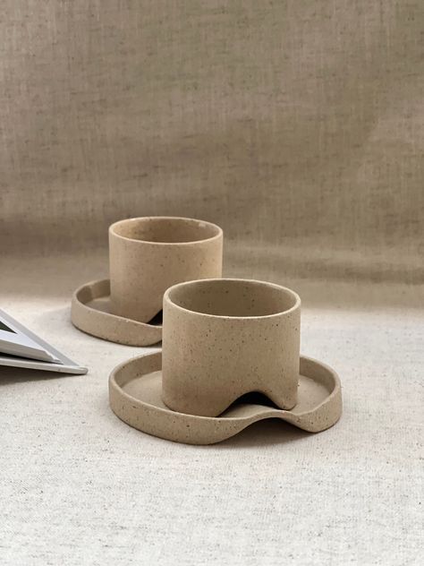 I made this 2 oz espresso coffee cup with a saucer to match the soft beige colour tone interiors. Enjoy your coffee with this modern minimalist design espresso cup and plan your day. The cup has a contemporary coffee cup design with wavy smooth edges, you will be happy to have this cool design piece in your collection.    The espresso tumbler was prepared with the slab method and fired at 1250 degrees. Hand-built ceramic espresso mug is perfectly sized for single-shot drinking. It is a handmade Espresso Cups Ceramic, Cozy Home Library, Espresso Mug, Plan Your Day, Coffee Cup Design, Cerámica Ideas, Creative Coffee, Diy Ceramic, Modern Minimalist Design