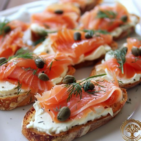 🐟 Elevate your appetizers with our Smoked Salmon Crostini! Perfect for any gathering! #GourmetBites Smoked Salmon Crostini Ingredients: Baguette, sliced (1) Cream cheese (8 oz) Smoked salmon (200g) Capers (2 tbsp) Dill, chopped (1 tbsp) Lemon juice (1 tbsp) Instructions: Toast baguette slices. Spread cream cheese on each slice. Top with smoked salmon, capers, and dill. Drizzle with lemon juice. 🍋🐟 A classy, tasty starter that's sure to impress at your next party! #SalmonCrostini Smoked Salmon Amuse Bouche, Smoked Salmon Cheese Board, Recipes With Smoked Salmon Slices, Smoked Salmon Croissant Sandwich, Smoked Salmon With Cream Cheese, Smoked Salmon Crostini, Bruchetta Appetizers, Salmon Crostini, Smoked Salmon Canapes