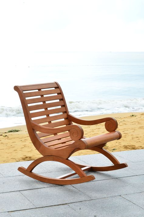 "The porch rocker gets a glamour makeover in this outdoor rocking chair with transitional lines that update the profile of a British classic. The porch rocker gets a glamour makeover in this outdoor rocking chair with transitional lines that update the profile of a British classic. Crafted of Eucalyptus wood in a teak brown finish, this piece is perfect reading, dozing or watching a sunset. Some Assembly Required Weight Limit: 275lbs Measurements: 25.2\" x 36.2\" x 37\" Construction: Eucalyptus Teak Rocking Chair, Rocking Chair Plans, Outdoor Rocking Chair, Porch Rocker, Rocking Chair Set, Best Outdoor Furniture, Eucalyptus Wood, Brown Furniture, Outdoor Rocking Chairs