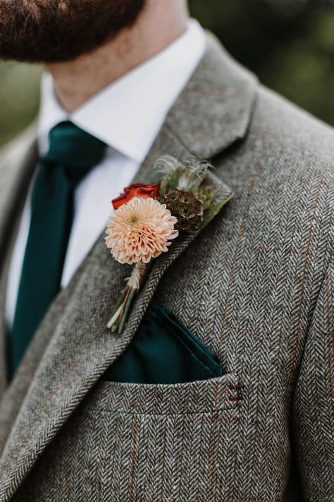 Groom in a grey tweed suit with a dark forest green tie and pocket square and a pink and red flower buttonhole Groom Suit Ideas Grey, Groomsmen Tweed Suits, Wedding Suit With Green Tie, Tweed Wedding Suits Groomsmen, Dark Green Tweed Wedding Suit, Dark Grey Suit Green Tie, Wedding Suit Inspiration, Tweed Suits Men Wedding, Dark Grey Suit With Green Tie