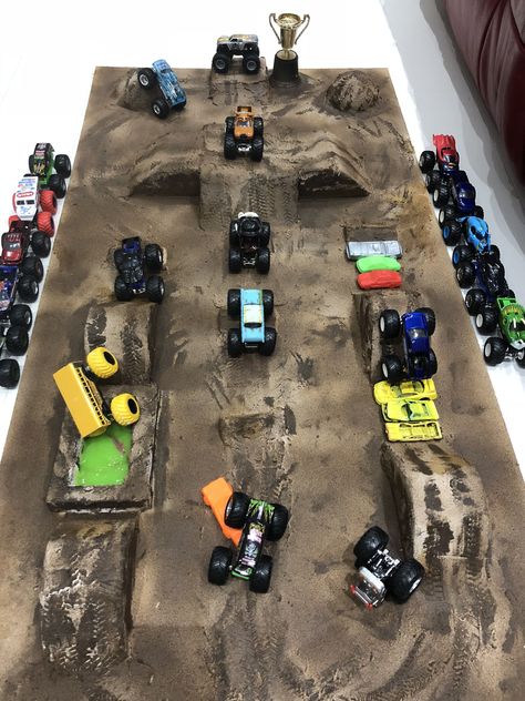 Monster Jam Activities, Monster Jam Birthday Activities, Monster Truck Garage Diy, Monster Truck Course Diy, Monster Truck Arena Ideas, Monster Jam Party Games, Cardboard Monster Truck Track, Monster Truck Obstacle Course, Diy Monster Jam Arena