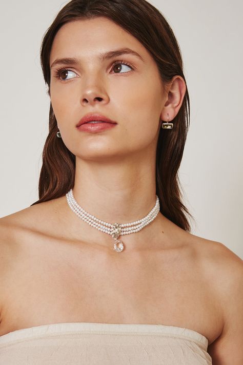 This layered pearl choker features a fluted silver pendant with a dazzling pear cut crystal drop. Fastens with a silver bar and lobster clasp. Sterling silver. 12" - 16" Adjustable. Handmade in Vietnam. Satin Choker, Silver Bar, Chan Luu, Pearl Earrings Dangle, Silver Bars, Pearl Choker, Crystal Drop, Pear Cut, High Quality Jewelry