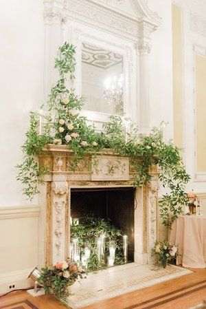 Mantle Decor, Wedding Flowers, A Garden Party, Rachel Pearlman Photography Decorated Mantel For Wedding, Wedding Mantel Decor, Fireplace Wedding Ceremony, Ruscus Garland, Wedding Fireplace Decorations, Mantle Greenery, Mantel Flowers, Fireplace Wedding, Wedding Mantle