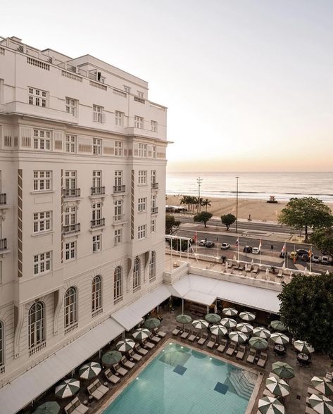 Copacabana Palace, A Belmond Hotel—Rio’s legendary playground of glamour. And there’s no better place to soak it all in than the Copa Pool, best enjoyed as the sun dips over some of the city’s most breathtaking landmarks, including Sugar Loaf Mountain, Ipanema Beach and the statue of Christ the Redeemer. #carewhereyoustay . . . #belmondcopacabanapalace #belmond #theartofbelmond #copacabana ​⁣#riodejaneiro #brazil #beautifulhotels #luxurytravel #luxuryhotel #traveldeeper #exploremore #luxurywo... Sugar Loaf Mountain, Copacabana Palace, Ipanema Beach, Belmond Hotels, Christ The Redeemer, Beautiful Hotels, Luxury Travel, Luxury Hotel, Rio De Janeiro