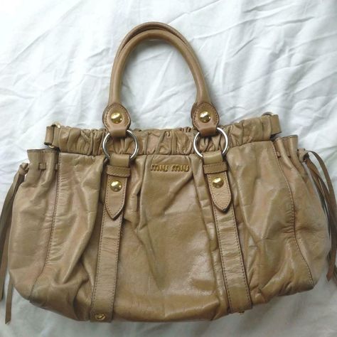 Auth Miu miu Handbag Tote bag #0311 Beige Leather  Description Condition: B (Good condition but signs of small scratches and/or stains) General : signs of wear, scratches, wrinkles, discoloration,stains Corner : abrasion Shoulder strap: missing Color Beige Size(approx):W cm H cm D cm Size(approx):W 0inch H 0inch D 0inch Condition: B  N : (New)  S : (Almost brand new)  A : (Great condition Light signs of use with tiny scratches and/or stains)   B : (Good condition but signs of small scratches and Summer Hand Bags, Vintage Bottega Veneta Bag, Vintage Miu Miu Bag, Beige Bag Outfit, Cute Small Bags, Miu Miu Handbags, Bottega Veneta Bag, Beige Tote, Vintage Tote Bag