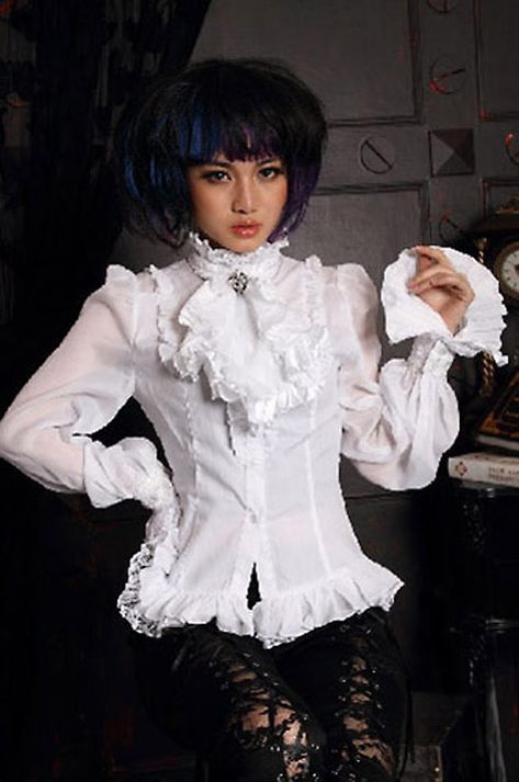 Remis en stock / Back in stock: Chemise blanche avec jabot lacage au dos manches ballon gothique victorien RQ-BL  Prix: 59.90  #new #nouveau #japanattitude #shirts #chemises #gothique #gothic #elegant #aristocrat #gothiclolita #victorien #victorian #visualkei #rock # #rqbl #21094wh #red #queen #black #legion #aristocrate #lolita #visual #kei #femme #blanc #coton #nylon #ammonium #lun #chemise #blanche #jabot #lacage #dos #manches #ballon #rq-bl Victorian White Shirt, Big Sleeves Blouse, White Shirt Outfit, White Ruffle Shirt, Gothic Blouse, Victorian Shirt, High Neck Shirts, Victorian Blouse, Frilly Blouse