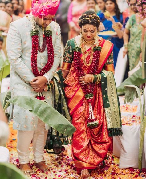 Nauwari Bride Groom Look, Phere Outfit For Bride Saree Look, Maharashtra Groom Outfit, Red Maharashtrian Bride, Navvari Bridal Look With Groom, Navari Bride And Groom, Vidhi Look For Bride And Groom, Vaidik Marriage Dress, Maharashtrian Couple Wedding Look