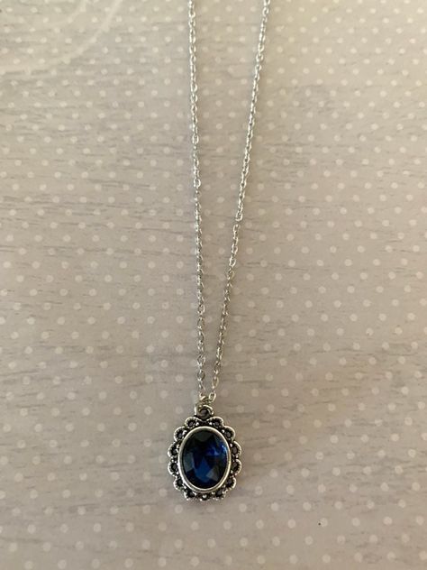 "Dainty, small and pretty vintage look indigo blue stone and antique silver tone Victorian style necklace.  Indigo blue center stone surrounded by antique silver tone filigree design.  Pendant measures 5/8\" L X 1/2\" W and is on an 18\" chain. ★ Want to see more?  Please visit my shop at: https://www.etsy.com/shop/DesignsByPeg" Indigo Necklace, Silver Prom Jewelry, Navy Blue Necklace, Navy Blue Jewelry, Necklace Blue Stone, Blue Pendant Necklace, Blue Stone Necklace, Blue Magic, Blue Pendant