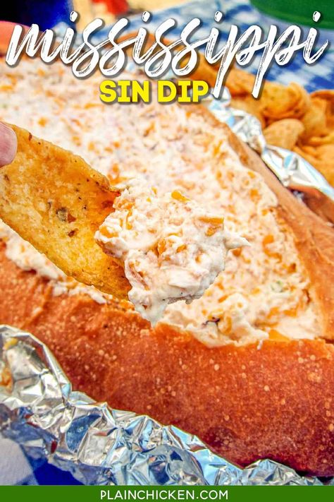 Mississippi Sin - SINFULLY delicious dip baked in a bread bowl. There is never any left when I take this to a party! Everyone asks for the recipe. Ham, cheddar cheese, cream cheese, sour cream, Worcestershire sauce, hot sauce, and green onions baked in french bread. Great for parties and watching football! #dip #ham #partyfood #appetizer #breadbowl Sin Dip, Mississippi Sin Dip, French Bread Loaf, Chopped Ham, Bread Bowl, Think Food, Bread Bowls, Football Food, Snacks Für Party