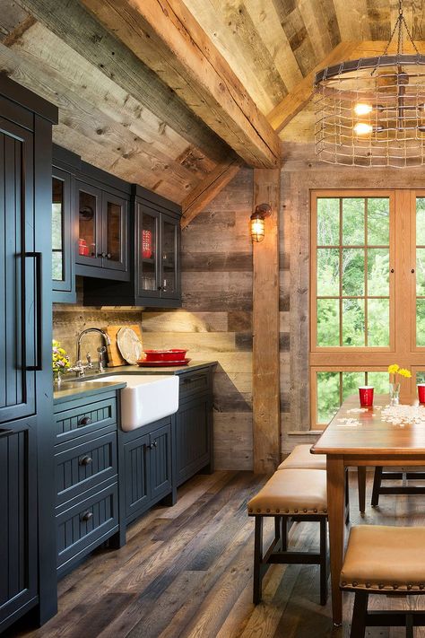 Rustic Kitchen With Black Cabinets | Dark wooden floor, table, wall details and white farm sink. Dark Cabinets With Light Countertops, Fintorp Ikea, Dapur Rustic, Northern Wisconsin, Rustic Kitchen Cabinets, Black Kitchen Cabinets, Dark Kitchen, Rustic Kitchen Design, Cabin Kitchens