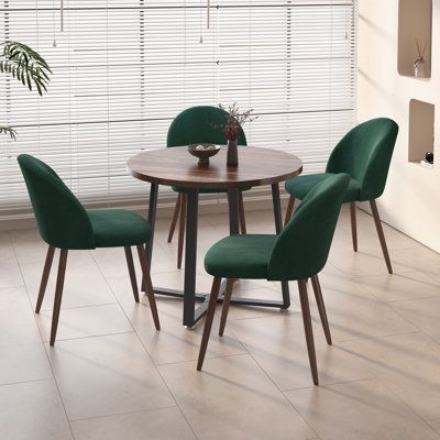 Designed for those who cherish space, our set redefines functionality. Ingeniously crafted chairs elegantly nest beneath the table, a dance of form and space that transforms any setting into a spacious haven for conversations. Ideal for small families! Chair Color: Green | George Oliver Jazabella Round 35.4" Dining Set Wood / Upholstered / Metal in Brown | 29.5 H x 35.4 W x 35.4 D in | Wayfair Small Round Dining Table, Dining Table Set For 4, Round Wooden Dining Table, Wooden Dining Table Set, Small Dining Room Table, Round Table And Chairs, Velvet Chairs, Brown Chair, Space Saving Kitchen