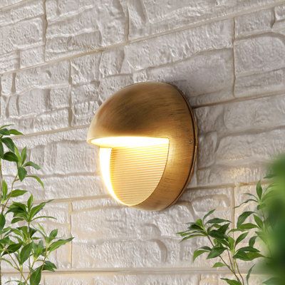 This small, round outdoor scone has a low-key modern style. Add some curves to the straight lines of mid-century modern - use a pair to flank a doorway or entry gate, or place a row along a wall for subtle exterior lighting. The durable black iron finish fits in everywhere. Fixture Finish: Antique Gold | Breakwater Bay Khalid LED Outdoor Flush Mount Metal in Yellow | Wayfair Entry Gate, Entry Lighting, Exterior Light Fixtures, Outdoor Flush Mounts, Mid Century Modern Walls, Modern Wall Sconces, Porch Lighting, Khalid, Led Wall Lights