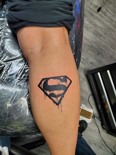 Superman tattoo Batman And Superman Tattoo Ideas, Super Man Logo Tattoo, Super Hero Tattoo Ideas, Superman Watercolor Tattoo, Super Hero Tattoos For Men, Small Superman Tattoo, Superman Chest Tattoo, Superman Symbol Tattoo, Dc Comics Tattoos Ideas