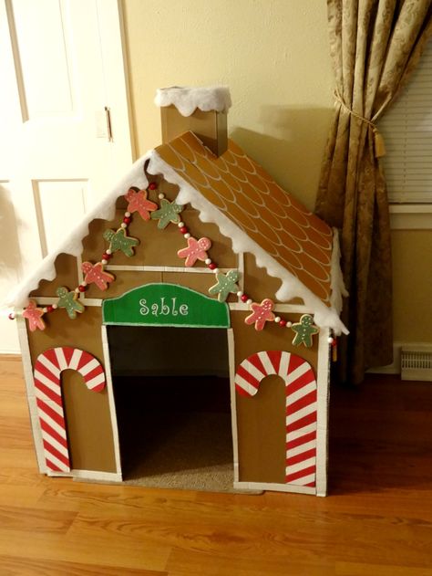 I wanted to decorate my dogs crate for Christmas so I built this Gingerbread dog house from a cardboard box. She can use it as an indoor dog house or I can use it to cover her crate when we have company over! Gingerbread Dog, Cardboard Gingerbread House, Gingerbread Diy, Gingerbread Christmas Decor, Dog House Diy, Cardboard House, Christmas Parade, Pet House, Office Christmas