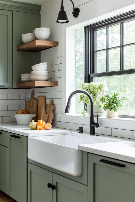 Discover the latest kitchen design trend with this modern farmhouse look! Featuring stylish green cabinetry, open shelving, and a deep farmhouse sink, this space combines functionality and elegance. Perfect for any home makeover! #kitchendesign #farmhousechic #homedecor Green Cabinetry Kitchen, Green Kitchen Floating Shelves, Green Farmhouse Cabinets, Farmhouse Sink Green Cabinets, Green Kitchen Butcher Block, Farmhouse Kitchen Green Cabinets, Green Farm Kitchen, Green Cabinets Butcher Block Countertops, Deep Green Kitchen