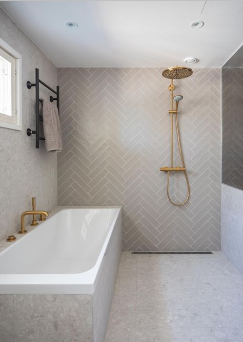 Fishbone Bathroom Tiles, Neutral Herringbone Tile Bathroom, Herringbone Feature Wall Bathroom, Bathroom Fishbone Tiles, Bathroom Tiles 2024, Herringbone Tiles Bathroom, Fishscale Tile Bathroom, Taupe Tile Bathroom, Herringbone Tile Bathroom Floor