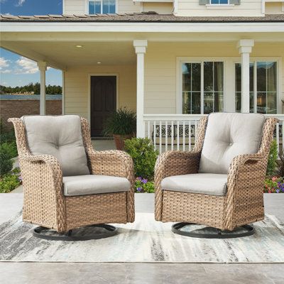 Enjoy the ultimate in comfort and style with the Carolina Outdoor Swivel Chair. Feathers 360 degree swivel, gentle swinging back and forth, this patio armchair features generous seating depth and thick cushions to allow you to relax and enjoy the outdoors. The wicker is hand-woven over powder-coated steel frames to withstand the outdoor elements, providing superior durability and toughness.This glider is perfect for various spaces, including your patio, porch, backyard, balcony, poolside, or gar Cozy Front Porch Furniture, Screened In Porch Seating, Rocking Patio Chairs, Screen Porch Furniture, Black Wicker Patio Furniture, Wicker Porch Furniture, Fun Sites, Screened In Porch Furniture, Bistro Patio Set