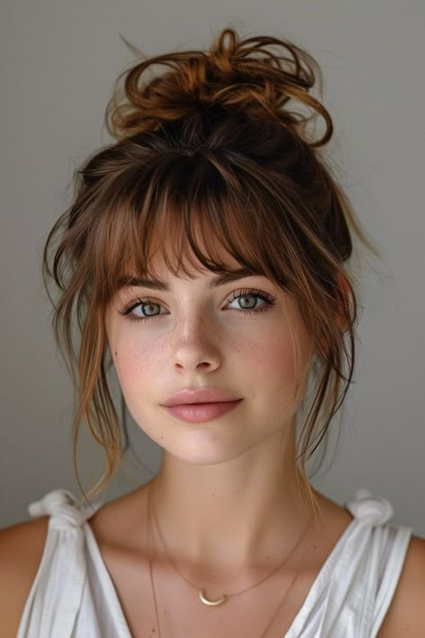 Add a sophisticated edge to your style with these 10 updos with bangs, blending elegance with contemporary chic. Bangs With Part In The Middle, Messy Fringe Bangs, Brunette Bangs Straight Hair, Bangstyle Hair Long Ponytail, Fun Edgy Haircut, Bangs Fall 2024, Wispy Face Framing Bangs Round Face, Updo Big Forehead, Haircuts With Bangs For Fine Hair