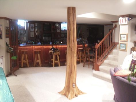 "AUTHENTIC CEDAR SUPPORT POLE COVER Just imagine your rustic basement complete with our unique solid cedar pole wraps! Our cedar trees include the roots for an authentic rustic feel that is a must-have for your rustic room. Each pole cover comes to you in two pieces, center bored and cut to approximately 8-1/2' length, ready to transform your pole and your room. Easy assembly with hardware included. FEATURES: Solid cedar wood Center bored to approx. 5\". Will fit standard 3-4\" pole diameters Ea Basement Pole Covers, Museum Activities, Cabin Homes Interior, Basement Poles, Rustic Basement, Support Post, Interior Columns, Cedar Log, Diy Basement