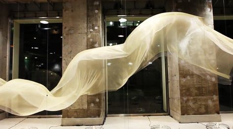 http://www.designboom.com/weblog/cat/10/view/19353/wow-bloom-skin-for-issey-miyake.html Fabric Installation, Wind Art, Interactive Installation, Window Installation, Display Design, Sculpture Installation, Light Installation, Stage Design, Window Display