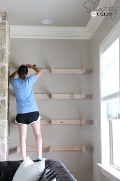 floating shelves......ashley-installing-shelves... Start with 2 by 4 constructed capital E frames attached on the starts... Build up hardwood plywood and one by six for the top and sides of each shelf... Put into place and secure perhaps with pegs or screws... used hardwood plywood to close out the bottom, screw those into place... stain everything before mounting and then touch up in place Shelves On Side Of Fireplace, Floating Shelves By Fireplace, Floating Shelves Around Tv, Shelves Around Fireplace, Side Of Fireplace, Shelves Around Tv, Building Shelves, Floating Shelves Living Room, Built In Shelves Living Room