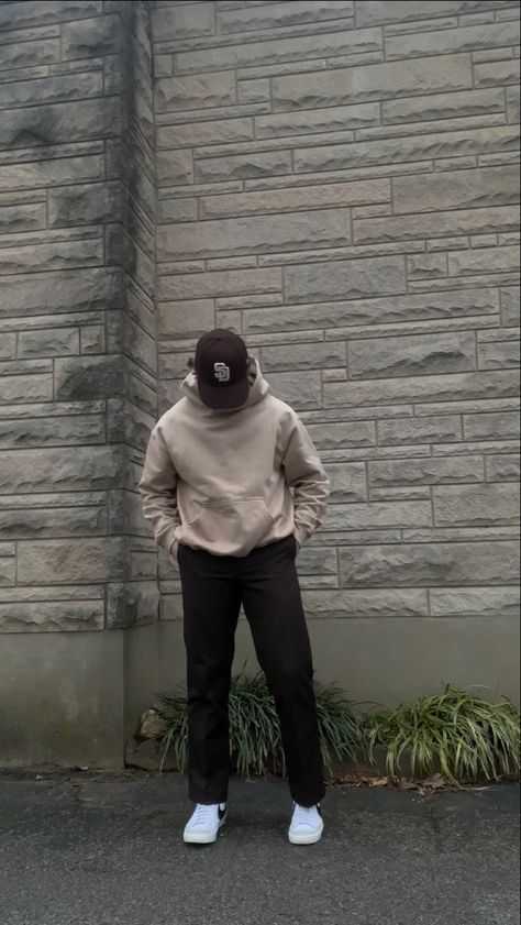 A simple streetwear outfit featuring neutral colors. The outfit includes a brown San Diego Padres hat, a khaki oversized hoodie from Rue Porter, brown Dickies 874 pants, and white Nike blazer mid 77’ sneakers with the black swoosh. Fits With Nike Blazers Men, Nike Hoodie Men Outfit, Light Brown Hoodie Outfit Men, Neutral Men Outfit, Neutral Outfits For Men, Guys Jeans Outfit, Tan Hoodie Outfit Men, Nike Blazer 77 Outfit Men, Tan Outfit Men