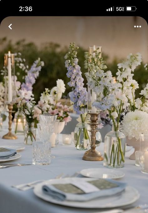 June Wedding Table Settings, Florals And Candles Wedding, Table Decor Lavender, Lilac Light Blue Wedding, Wedding Table Decorations Light Blue, Romantic Table Centerpieces, Wedding Table Flowers With Candles, Light Blue Purple And White Wedding, Pink White Lilac Flowers