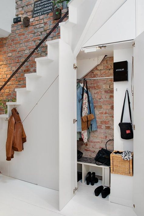 Stylish Solutions for Awkward Spaces You're Not Sure How to Tackle | Tight corners, the space under your stairs, the tops of cabinets—these awkward spaces are the great equalizers of design. Here are some ideas to help you tackle these dead zones. Closet Under The Stairs, Space Under Stairs, تحت الدرج, Små Rum Lidt Plads, Vstupná Hala, درج السلم, Open Trap, Swedish Apartment, Staircase Storage