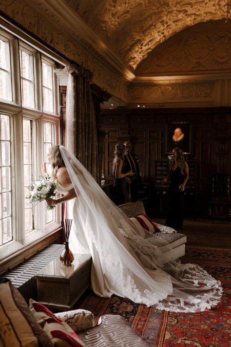 Bride looking out of window of large country ,manor house Traditional British Wedding, Uk Countryside Wedding, Wedding Manor House, Manor House Wedding Reception, Country Manor Wedding, English Manor Wedding, Country Estate Wedding, Saltburn Wedding, Old English Wedding