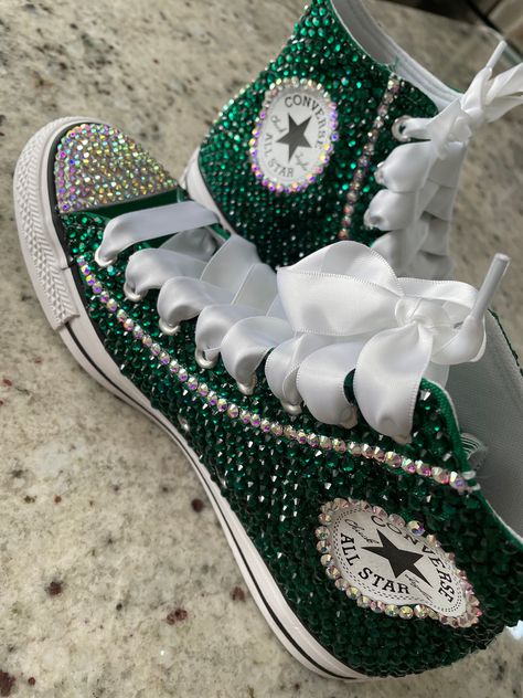 Any color Converse completely covered in the stone color of your choice! Satin laces also dress up this stylish shoe.  You pick color and how you want the shoe done.  Please tell me shoe size and what you are looking for in the notes section. Green Prom Dress With Converse, Green Bling Converse, Prom Dress With Converse High Tops, Quinceanera Shoes Sneakers Green, Birthday Theme Ideas 13, Emerald Green Quince Shoes, Quince Shoes, Bejeweled Shoes, Bedazzled Converse