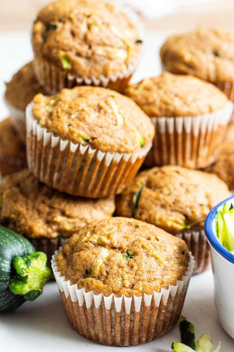 Healthy Zucchini Muffins are inspired by my whole grain healthy zucchini bread and taste amazing! Easy to make in one bowl, the results are light, fluffy, moist muffins loaded with flecks of zucchini and sweetened only with maple syrup. Zucchini Applesauce Muffins, Healthy Zucchini Muffins, Gluten Free Zucchini Muffins, Zucchini Muffins Healthy, Banana Zucchini Muffins, Banana Zucchini, Whole Wheat Muffins, Zucchini Bread Healthy, Zucchini Muffin Recipes