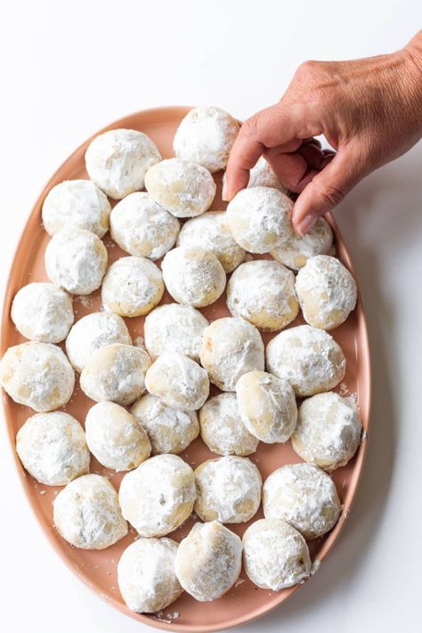 Mexican Wedding Cookies are a buttery, nutty cookie rolled in powdered sugar, popular for Cinco de Mayo and Christmas- or the anytime cookie! #mexicanweddingcookie #reluctantentertainer #snowballcookie Mexican Wedding Cake Cookies, Mexican Wedding Cookies Recipes, Powdered Sugar Cookies, Wedding Cookies Recipe, Mexican Cookies, Mexican Wedding Cookies, Wedding Cake Cookies, Cookie Christmas, Snowball Cookies