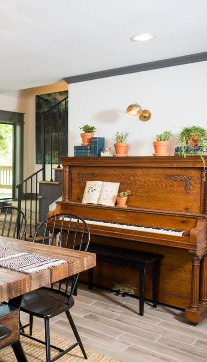 Piano Dining Room HGTV Fixer Upper Old-World Charm for Newlyweds. Modern Rustic Farmhouse. Piano By Fireplace, Piano In Dining Room Upright, Piano In Kitchen, Piano Next To Fireplace, Dining Room With Piano, Piano Dining Room, Piano In Dining Room, Dining Room Piano, Farmhouse Piano