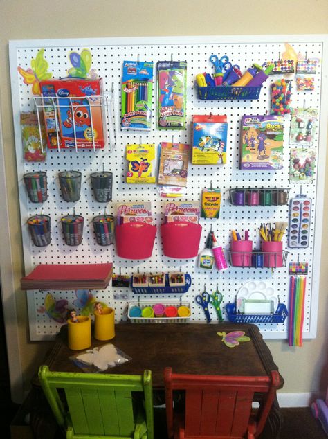 This is an art/craft wall my husband and I created for our 3 year old twin grandaugters.  They love it and love working on art projects...peg board, hooks, buckets, shelves etc.  hours of fun...add to the board with new finds... Ikea Organisation, Daycare Setup, Board Organization, Peg Boards, Toddler Organization, Ikea Organization, Boys Playroom, Kids Desk, Kindergarten Design