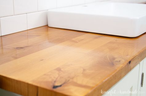 I absolutely love the look of this bathroom vanity! Add some rustic warmth to your farmhouse bathroom by adding a waterproof wood vanity top. Learn how to build & protect a wood vanity top for your next DIY renovation. | Housefulofhandmade.com Wood Vanity Top, Bathroom Countertops Diy, Half Bathroom Remodel, Waterproof Wood, Wood Sink, Rustic Bathroom Vanities, Diy Bathroom Remodel, Diy Countertops, Bathroom Countertops