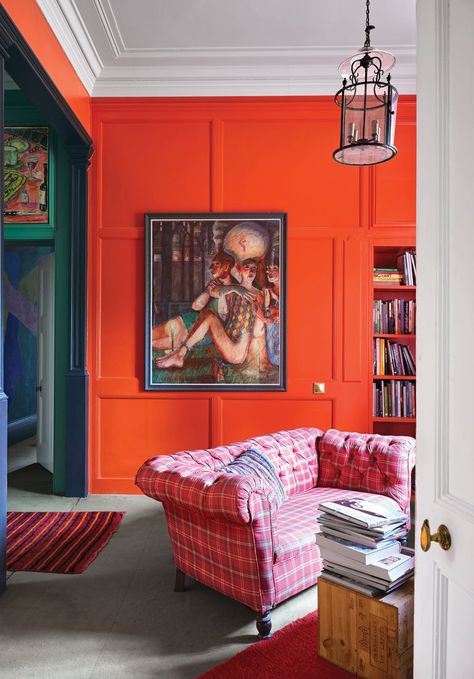 A plaid pink sofa is backed by a sunset orange wall. Plaid Sofa, Orange Rooms, Living Room Orange, Pink Sofa, Orange Interior, Orange Walls, Vintage Sofa, Maine House, Elle Decor