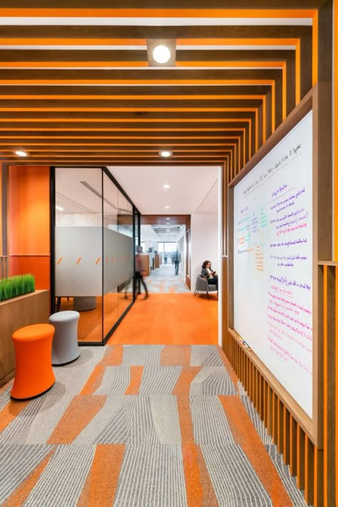 Phone Room Design, Fun Office Design Work Spaces, Orange Office Design, Vibrant Office Design, Orange Interior Design, Industrial Interior Office, Herndon Virginia, Bureau Open Space, Glass Graphics