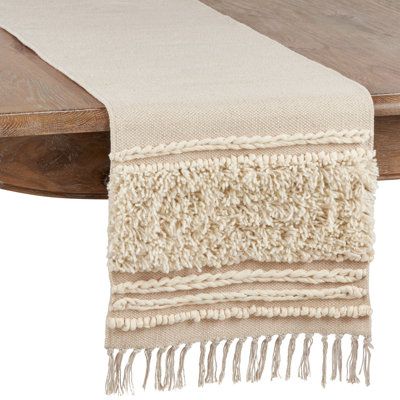 Boasting a diverse combination of textures, this knotted design table runner will add a lovely touch of modern bohemian to your tabletop. It features neutral colors for the perfect foundation to accessorize with. | Dakota Fields Phaedra Solid Color 100% Cotton Table Runner Cotton in Gray/White, Size 72.0 W x 16.0 D in | Wayfair Applique Table Runner, Dining Table Runners, Long Table Runner, Handmade Table Runner, Stylish Tables, Long Table, Dining Room Small, Handmade Table, Modern Bohemian