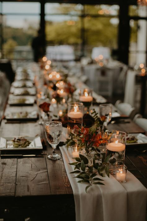 Wedding Table Decor with Cheesecloth Runner and Greenery Arrangements with Floating Candle Centerpieces Autumn Wedding Long Table, Rustic Candle Centerpieces Wedding, Rustic Wedding Candles, Fall Table Arrangements Wedding, Harvest Table Centerpieces Wedding, Fall Wedding Farmhouse Table Decor, Long Table Centerpieces For Party, Candle Runner Centerpiece, Fall Wedding Simple Table Decor