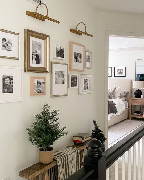 Gallery Lights Wall, Art With Lighting Above, Gallery Wall With Small Frames, Gallery Wall For Large Wall, Wall Sconces Hallway Pictures, Entry Table With Gallery Wall, Framed Photographs On Wall, Tasteful Gallery Wall, Gallery Wall With Shelf Living Room