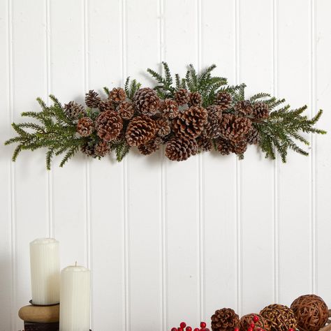 "Buy the 28\" Iced Pinecone Swag at Michaels. com. A perfect addition to any home’s holiday décor, this accent is perfect for hanging in any room, or displaying on any table. Nothing says the holidays quite like a bit of swag, right? Well, iced pine cone swag, that is. A perfect addition to any home’s holiday décor, this accent is perfect for hanging in any room, or displaying on any table. A selection of pine cones looks as if they have been kissed by newly fallen snow, as they nestle themselve Pinecone Decorations Diy, Pinecone Swag, Pine Cone Tree, Neutral Holiday Decor, Woodland Christmas Tree, Dollar Store Christmas Crafts, Pine Cone Art, Christmas Mantle Decor, Dollar Store Christmas