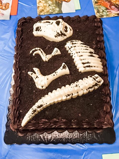 This easy DIY dinosaur cake is perfect for the dino lovin’ kid in your life Dinosaur Fossil Birthday Cake, Dinosaur Fossil Party, Fossil Birthday Party, Dinosaur Fossil Cake, Diy Dinosaur Cake, Fossil Cake, Paleontologist Party, Fossil Party, Dinosaur Cakes For Boys