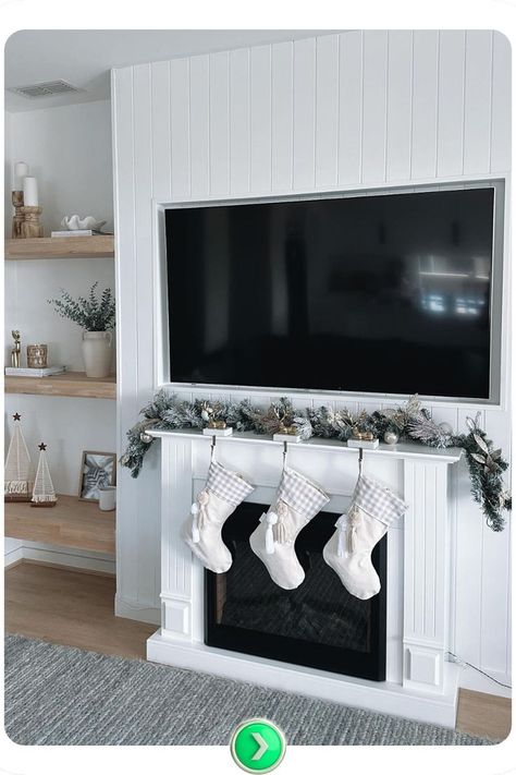 White and green fireplace Christmas decor with stockings and fresh greenery. Cozy and inviting, this arrangement is ideal for a simple yet elegant holiday look. Simple Christmas Fireplace, Fireplace Christmas Decor, Green Fireplace, Classy Christmas Decor, Fireplace Christmas, Christmas Fireplace Decor, Christmas Decor Inspiration, Classy Christmas, Christmas Fireplace