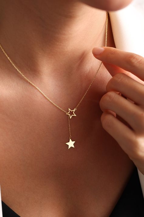 Star Charm Necklace, Tiny Star Necklace,  Super Star Necklace, Star Choker, Stars Necklace, Layering Necklace, Gift for her, christmas gift STAR NECKLACE Dainty gold star lariat necklace, perfect to wear by itself for a minimal look or layer it up with other necklaces. Our products are carefully prepared by our company from 925 Sterling silver. We offer you years of experience, product and service quality. FINISHED COLOR: Silver - Gold - Rose Gold Necklace length: 14 INCHES 15 INCHES 16 INCHES 17 INCHES 18 INCHES 19 INCHES 20 INCHES 21 INCHES 22 INCHES This necklace is the perfect gift for you loved ones. We wish you to use our products on happy days. Please visit my store for my other items. https://www.etsy.com/shop/onixjewellry Thank you so much for visiting and hope you enjoy shopping Gold Star Jewelry, Star Gold Necklace, Tiny Star Necklace, Gold Star Necklace, Star Choker, Stars Necklace, Star Necklace Gold, Necklace Star, Star Charm Necklace