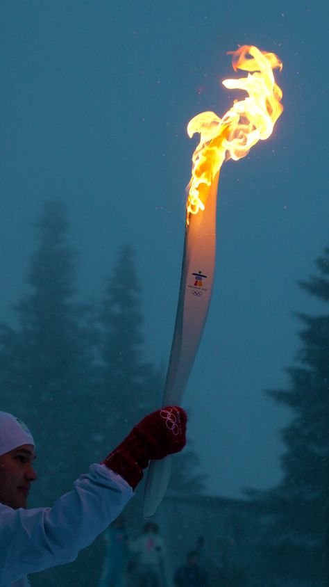 The Olympic Torch burns on at Grouse Mountain during the 2010 Winter Olympic Games in Vancouver, Canada. Olympics Aesthetic Paris 2024, Winter Olympics Aesthetic, Athlete Vision Board, Olympic Games Aesthetic, Olympic Aesthetic, Olympics Aesthetic, Vision Wallpaper, Runner Aesthetic, Wallpaper Nike