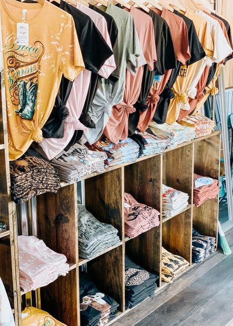 Vendor Boutique Display, Boutique Shirt Display, Diy Clothing Display Ideas, T Shirt Craft Show Display, Boutique Clothing Displays Small Spaces, Diy Store Display Retail Clothing Racks, Clothing Boutique Interior Design Display Ideas, Western Store Front Ideas, Window Display Design Creative Boutique