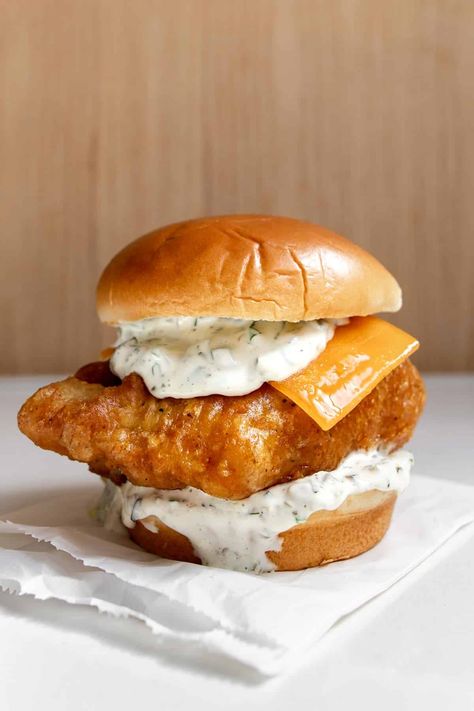 Inspired by the original Filet-O-Fish, our Fried Cod Fish Sandwich is crispy, tender, and tangy in every bite. With a large filet of crispy fried cod, this fish sandwich is topped with homemade tartar, a half slice of American cheese, and a steamed bun. It’s just like the classic McDonald's version but only better, in our opinion. Crispy Cod Sandwich, Mcdonald’s Filet Fish, Fried Cod Fish Sandwich Recipes, Filet Of Fish Sandwich, Fried Cod Sandwich, Fried Fish Sandwich Recipes, Cod Sandwich Recipes, Cod Fish Sandwich, Fried Cod Fish Recipes